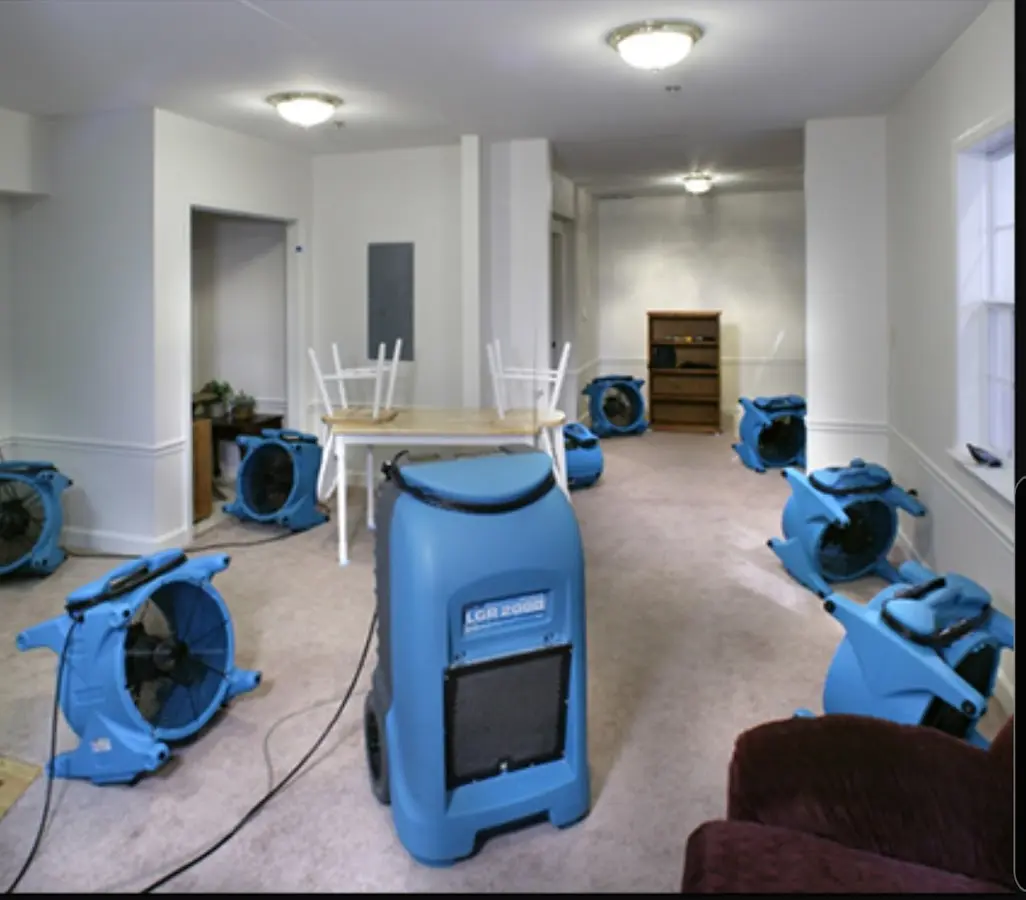 Air movers and dehumidifier setup for Water Damage Restoration in Solvay